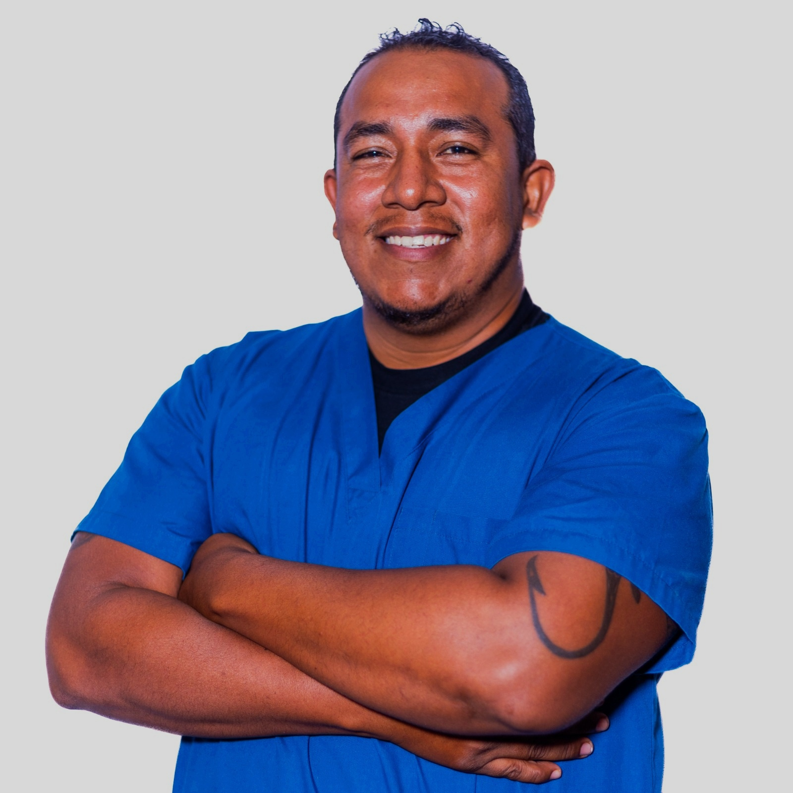 Dr. Javier O. Canul wearing blue scrubs